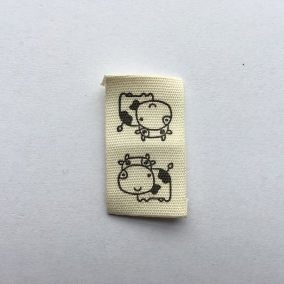 Naszywka materiałowa 2,0x3,5 cm Krowy